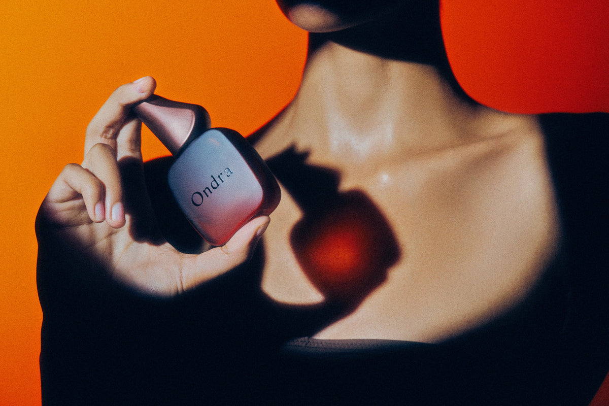 An ONDRA bottle held out towards the viewer